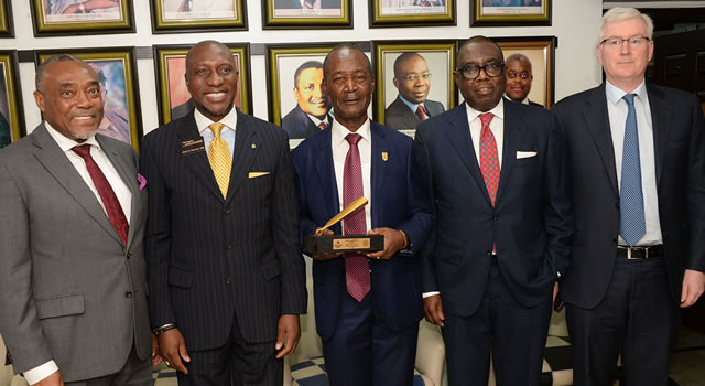 PHOTOSCENE: Stock Exchange calls for more partnership as Dangote Cement visits