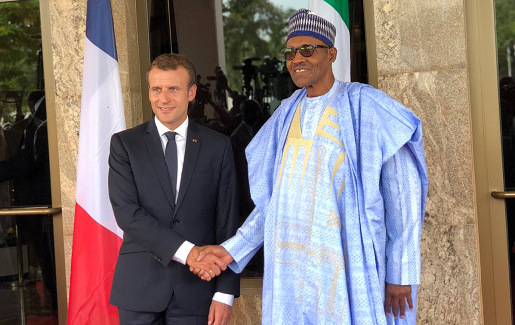PHOTOSCENE: French President Macron meets Buhari in Abuja