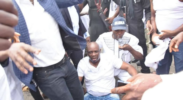 PHOTOSCENE: Police invade Ekiti govt House, Fayose tear gassed, faints