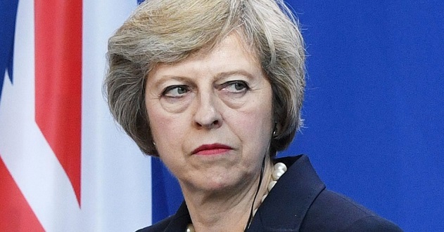 Theresa May under immense pressure in the face of resignations as she pushes draft Brexit agreement