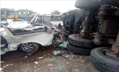 15 passengers escape death as truck crushes a 14-seater bus