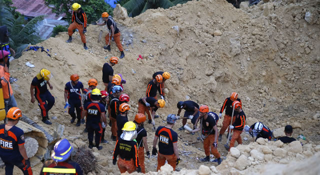 Landslides claim 21 lives in the Philippines, buries scores of houses