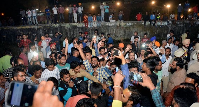59 people feared dead as train runs into crowd in India