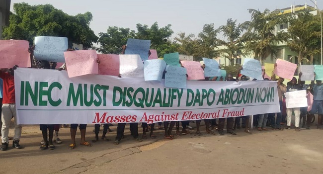 Protesters storm INEC office, demand disqualification of APC gov candidate, Abiodun