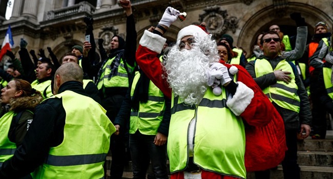 21 people arrested as France "yellow vest" protesters defy stay at home call