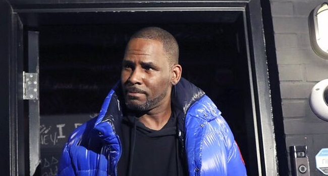 R Kelly surrenders to police after being charged for sexually abusing 4 girls