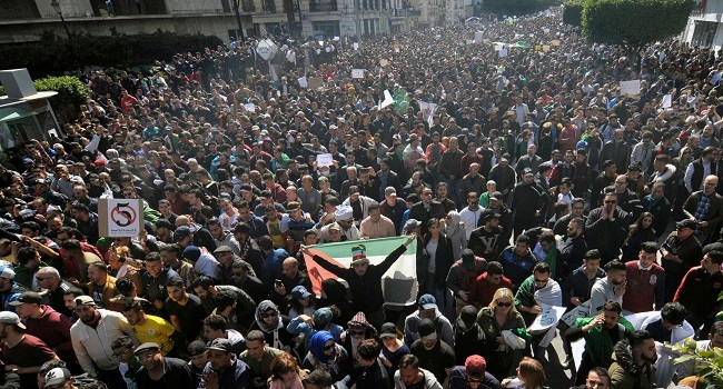 One dead, 63 wounded, 45 detained as protesters call on Algeria President to step down