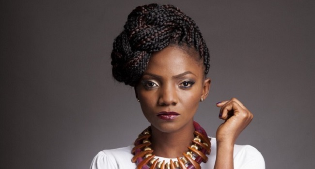 Woman' Lyrics By Simi, Official Lyrics