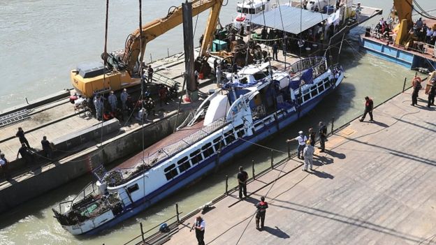 Rescue team recover bodies as sunken tour boat is raised in Hungary