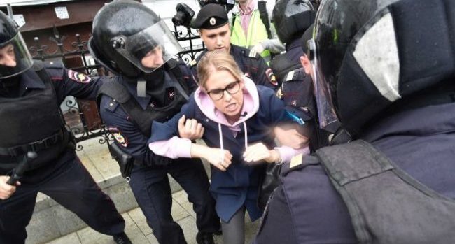 Russian police arresting protesters at Pushkin Square in Moscow