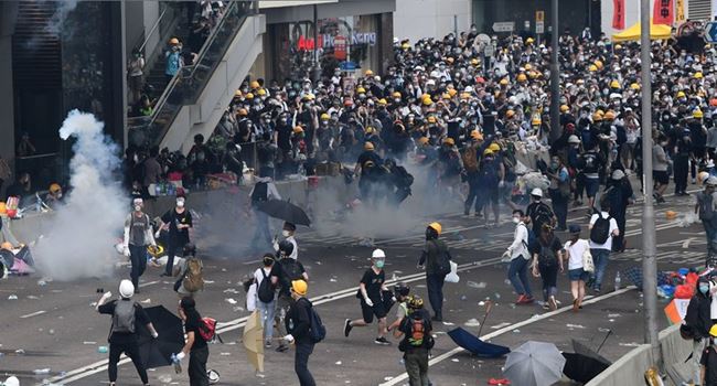 Demonstrators cripple Hong Kong as thousands join protests