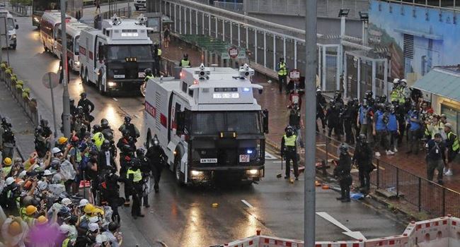 Police arrest 29 people, draw guns in fresh outbreak of violent protests in Hong Kong