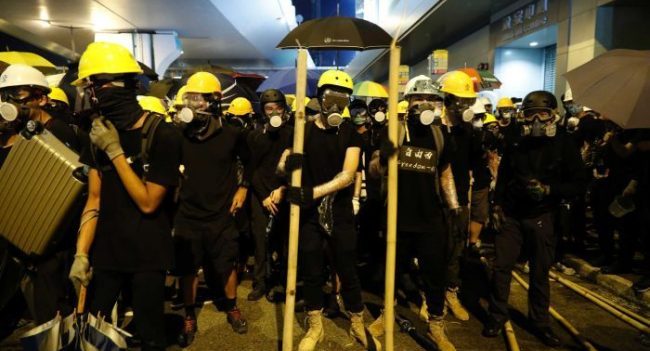 Trains, planes grounded in Hong Kong as violent protests deepen