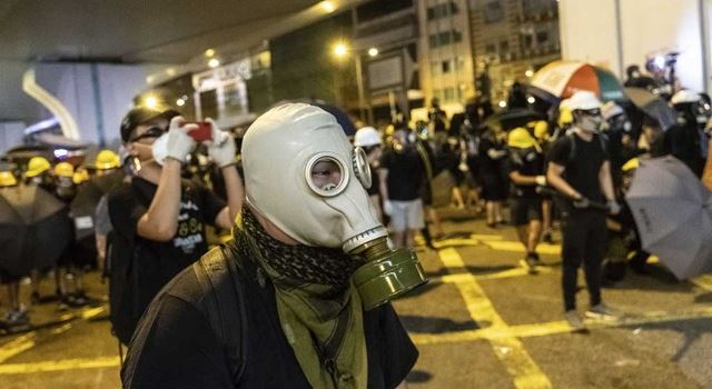Pro-democracy protesters in Hong Kong throw Monday morning train travels into chaos