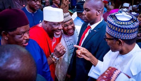 Dino greeting Buhari during budget presentation