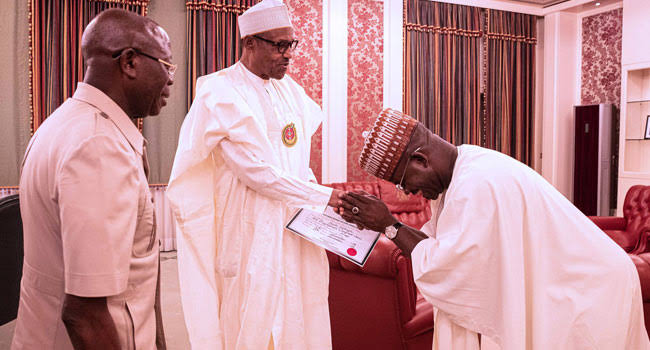 All smiles as Bello presents certificate of return to Buhari