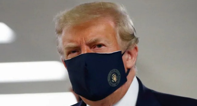 US President Trump wears face mask in public for first time
