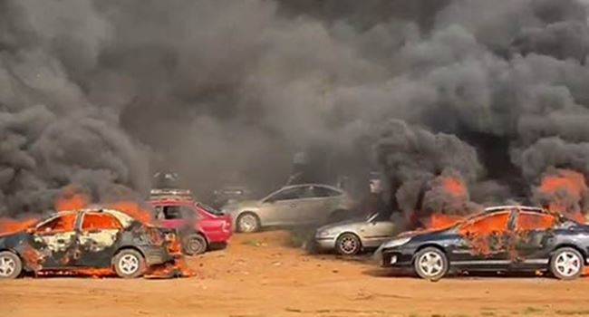 Hoodlums attack #EndSARS protesters, set cars ablaze in Abuja