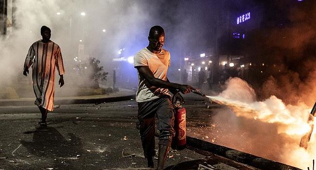 Senegalese youths protest over new Covid-19 curfew