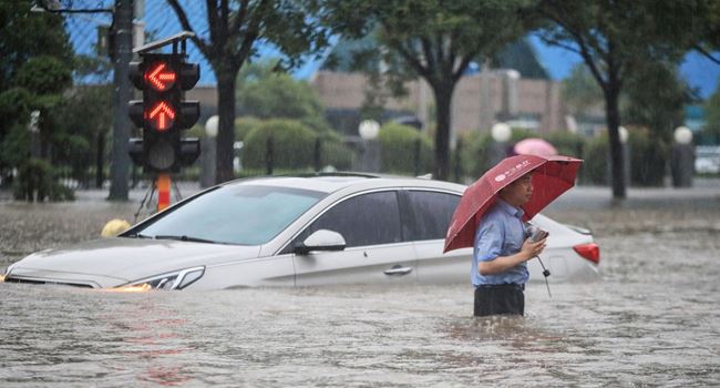 12 dead, thousands evacuated in China floods