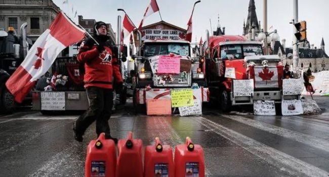 After weeks of protest, key US-Canada bridge reopens as police clear demonstrators