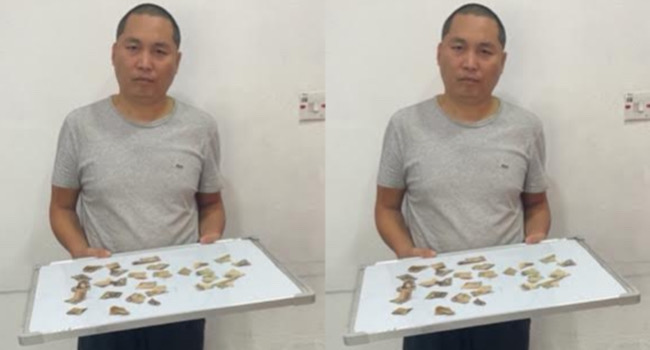 Court jails Chinese national for mutilating naira