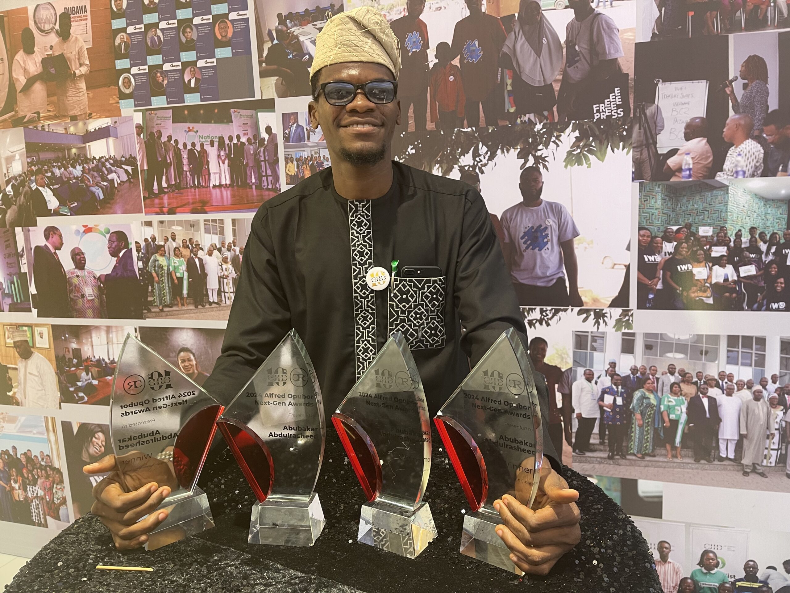 Picture 1: Abdulrasheed with his four awards won at the award event.